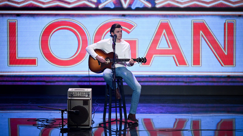 Logan Crosby playing guitar