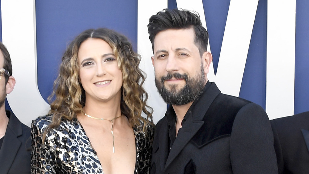 Sara Dudley smiles alongside Matthew Ramsey at an event