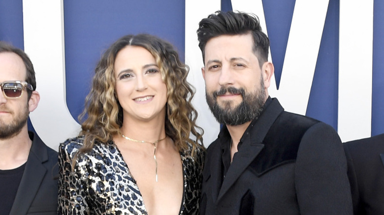 Sara Dudley smiles alongside Matthew Ramsey at an event