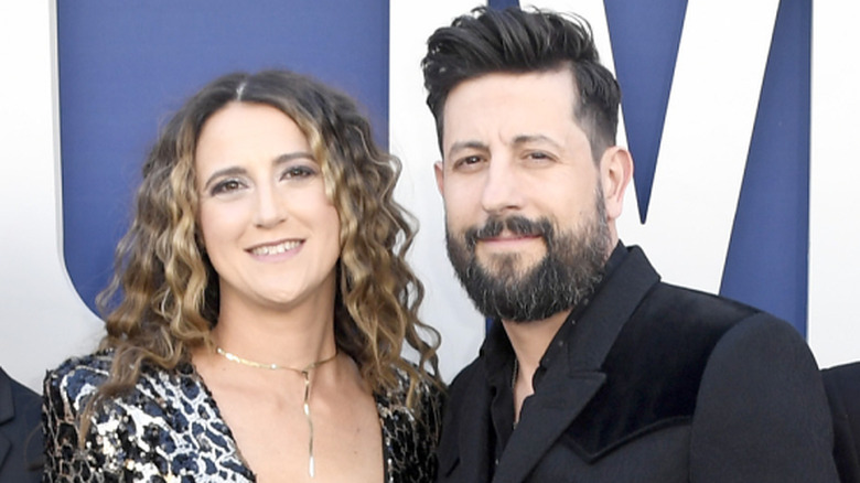 Sara Dudley and Matthew Ramsey smiling at the 2019 AMAs