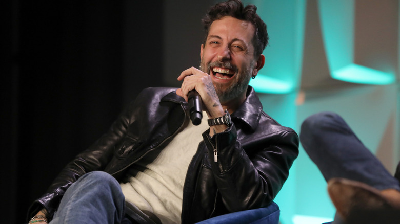 Matthew Ramsey holding a microphone