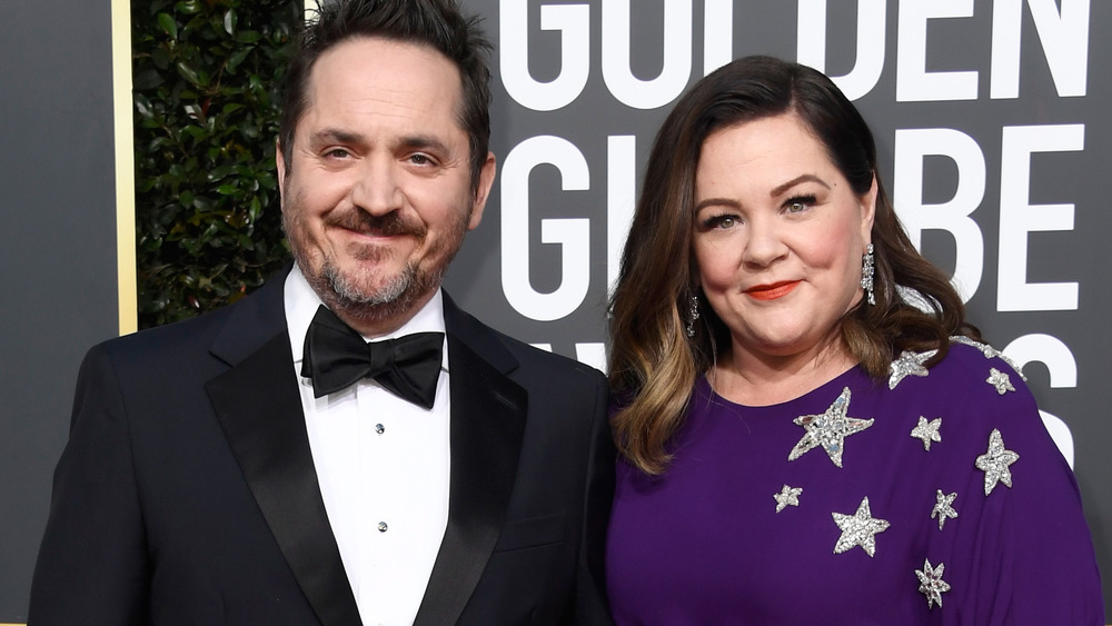 Ben Falcone poses with Melissa McCarthy on the red carpet at the Golden Globes