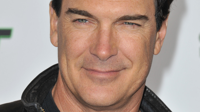 Patrick Warburton smiles on the red carpet