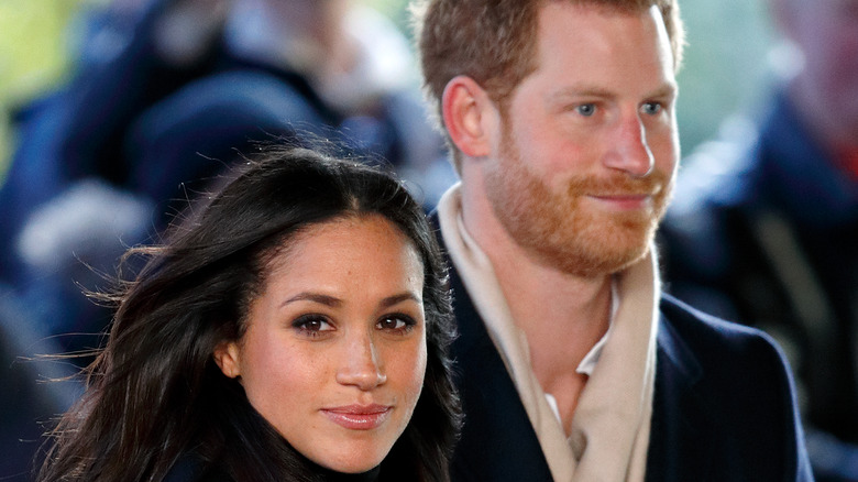 Meghan Markle and Prince Harry attending a Terrence Higgins Trust World AIDS Day charity fair