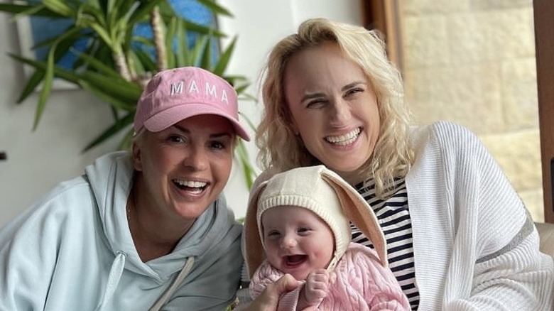 Ramona Agruma and Rebel Wilson with their baby.