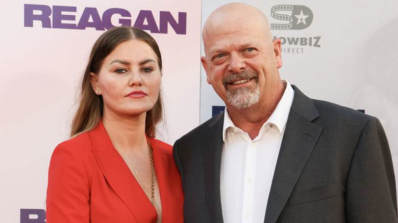 Angie Polushkin and Rick Harrison posing together at an event