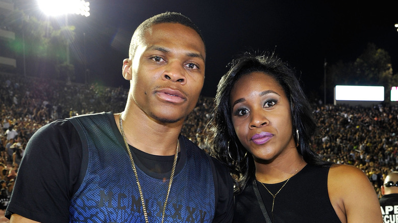 Russell Westbrook and Nina Westbrook (nee Earl) posing in 2014