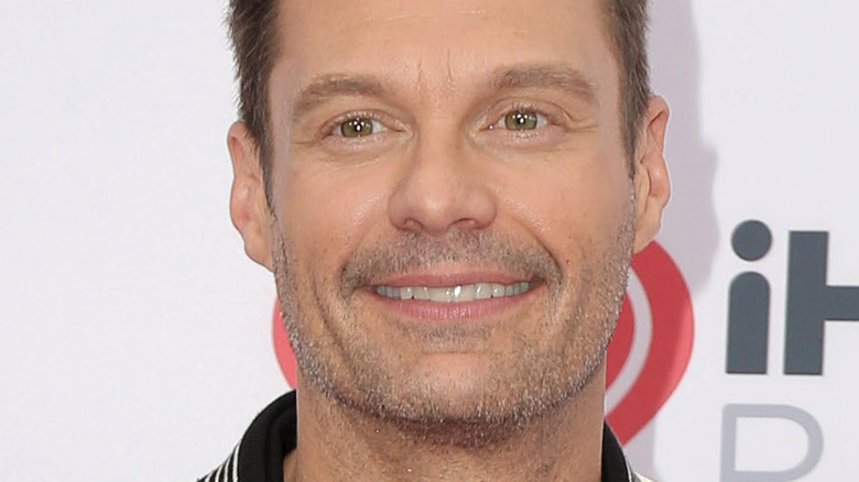 Ryan Seacrest smiling at an iHeart Radio event