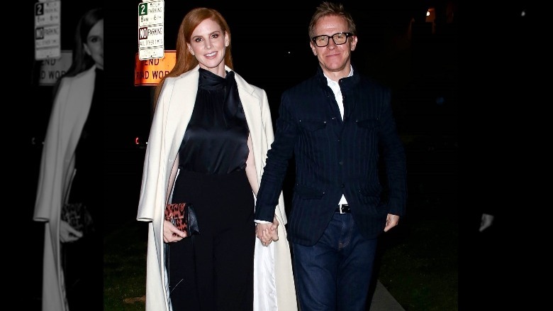 Sarah Rafferty and husband Santtu Seppala holding hands