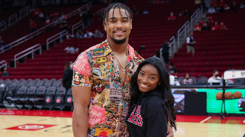 Jonathan Owens with arm around Simone Biles