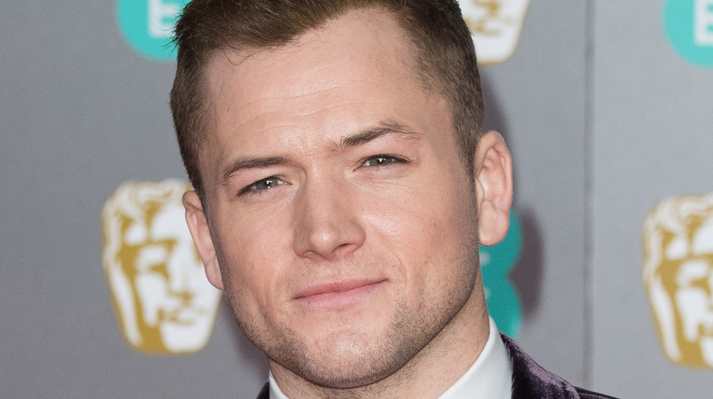 Taron Egerton posing on red carpet