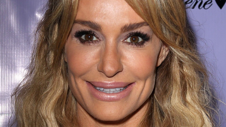 Taylor Armstrong smiling on red carpet 