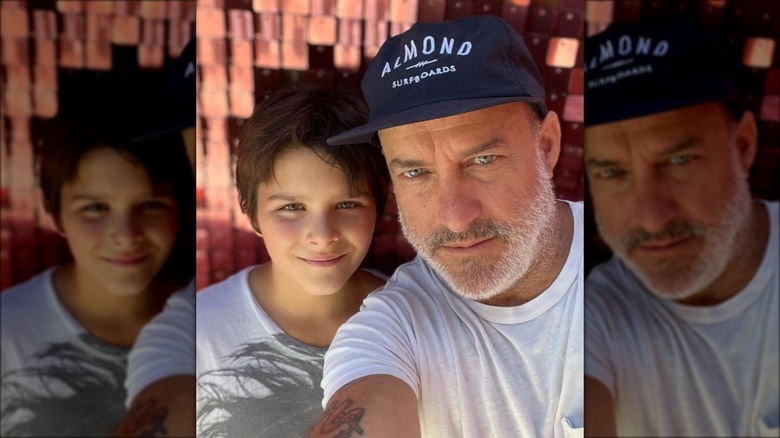 Jason Bleick posing with son Arthur