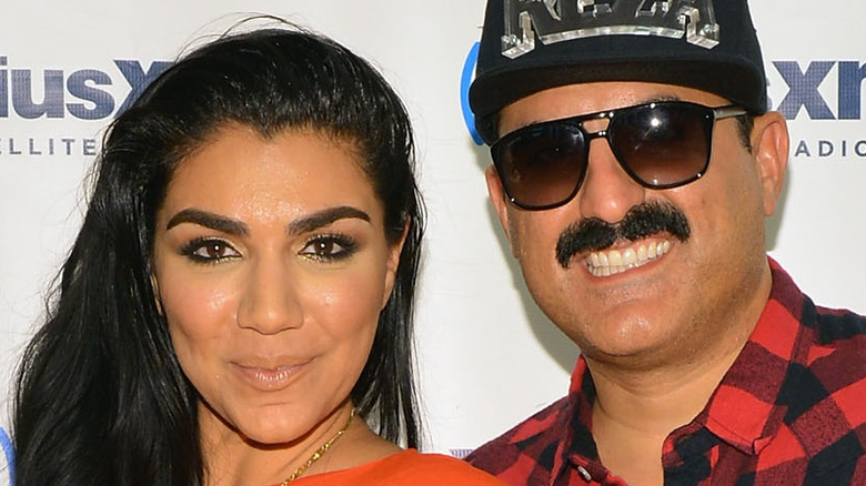 Shahs of Sunset cast members Asa Soltan Rahmati and Reza Farahan posing