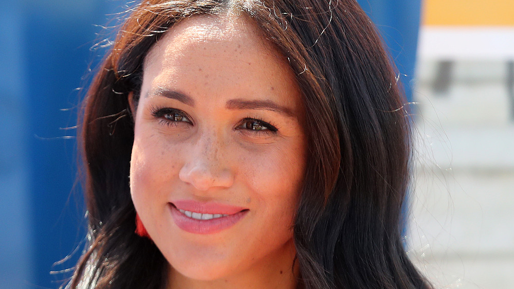 Meghan Markle smiling at an event