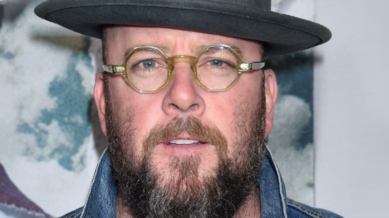 Chris Sullivan in hat on red carpet