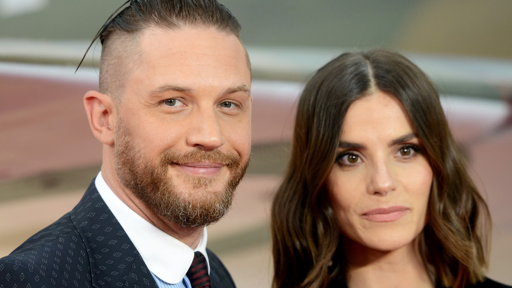 Charlotte Riley and Tom Hardy pose at an event