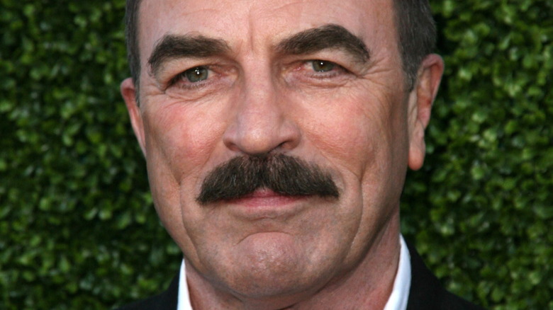 Tom Selleck poses in a suit.