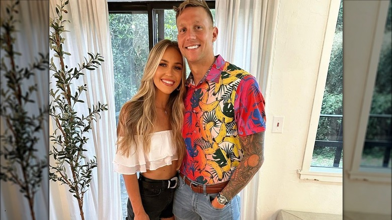 Caeleb and Meghan Dressel posing in front of door
