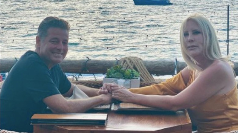 Vicki Gunvalson and Steve Lodge at a dinner table 