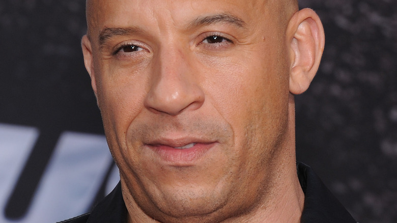 Vin Diesel wears a black button down shirt