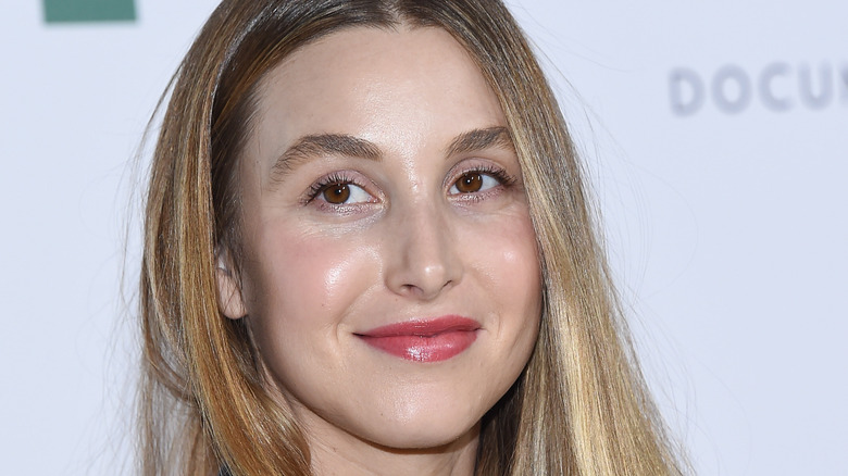 Whitney Port posing at a red carpet event