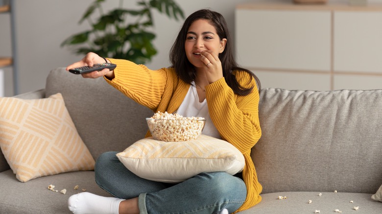 woman holding remote