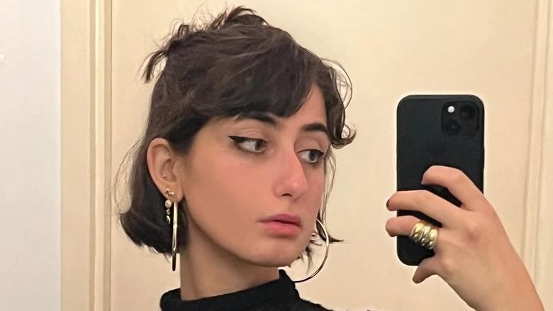 Rama Duwaji taking a selfie with iPhone