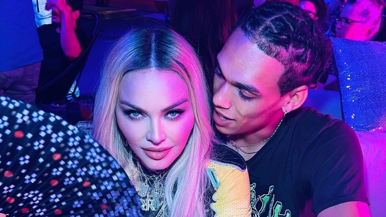 Madonna, Andrew Darnell sit close