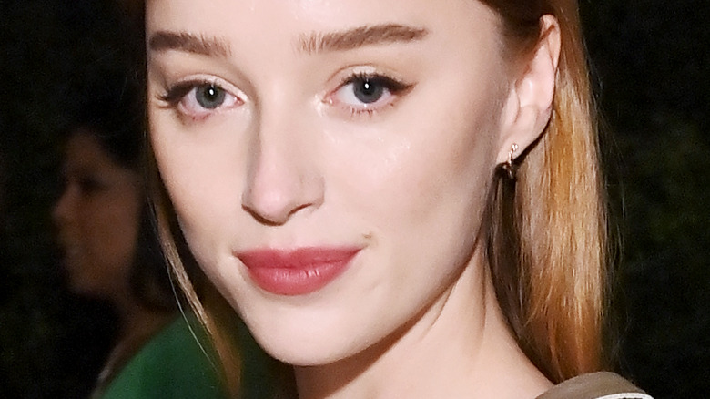 Phoebe Dynevor posing at an event