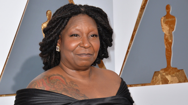 Whoopi Goldberg smiles at the Oscars