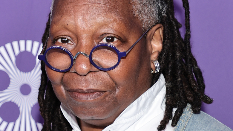 Whoopi Goldberg in round glasses