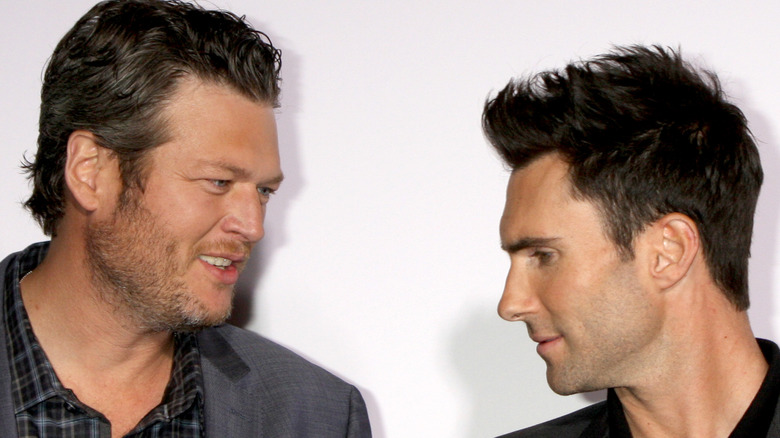 Blake Shelton and Adam Levine posing