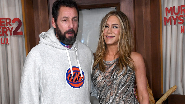 Adam Sandler and Jennifer Aniston pose 