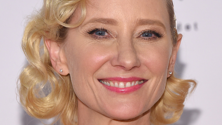 Anne Heche smiling short blonde curly hair