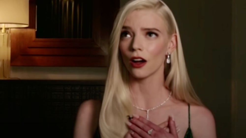 Anya Taylor-Joy speaking at the Golden Globes with nails visible