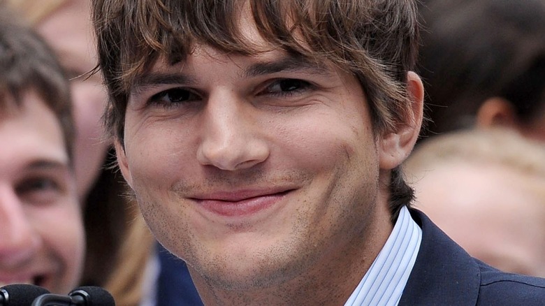Ashton Kutcher smiles on the red carpet