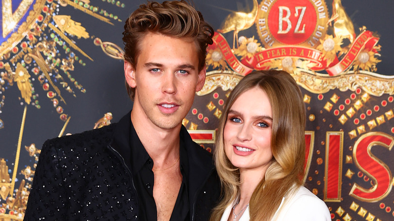 Austin Butler and Olivia DeJonge posing for pictures