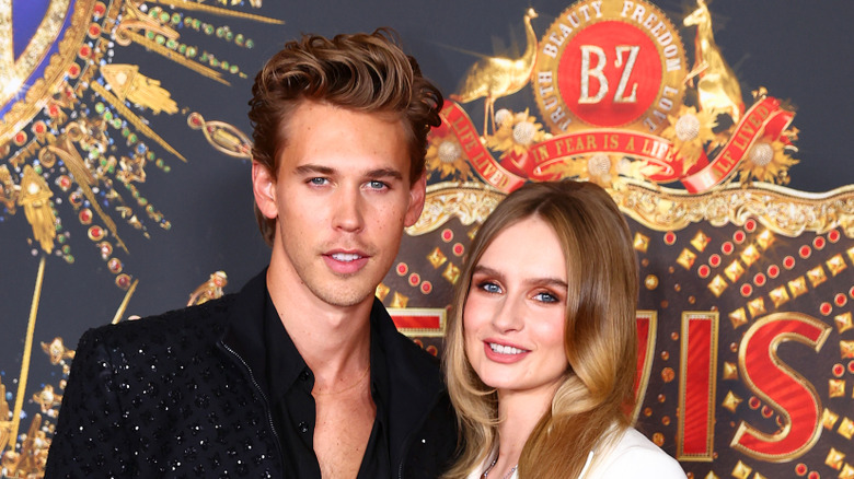 Austin Butler and Olivia DeJonge posing for pictures