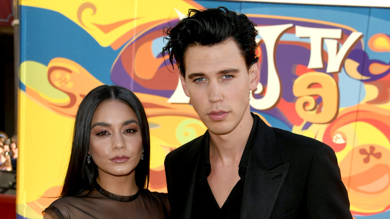 Austin Butler with his arm around Vanessa Hudgens