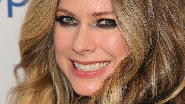 Avril Lavinge smiling on the red carpet