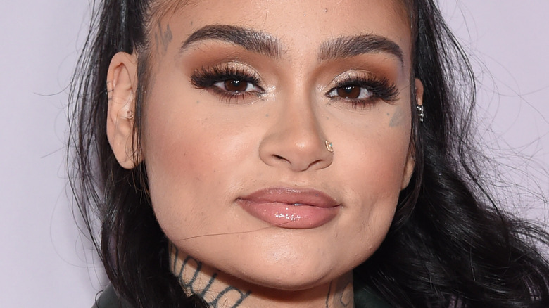 Kehlani poses with hair pulled up