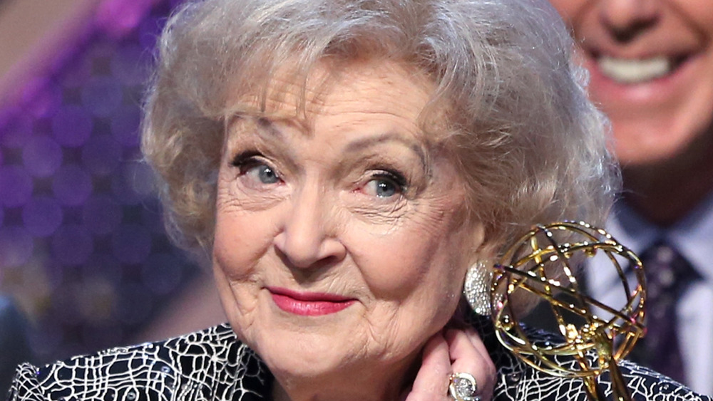 Betty White smiling at the podium at the Emmys