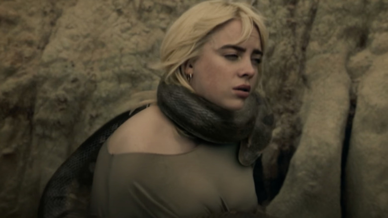 Billie Eilish posing with a snake