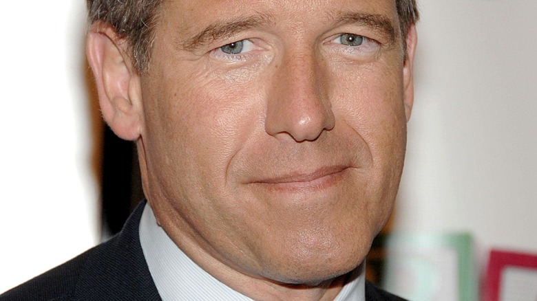 Smiling Brian Williams at the "Girls" season four series premiere in 2015 