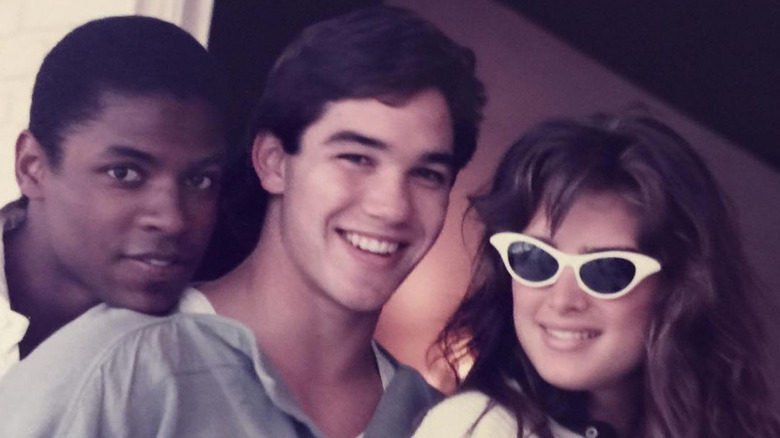 Dean Cain and Brooke Shields pose with a college friend