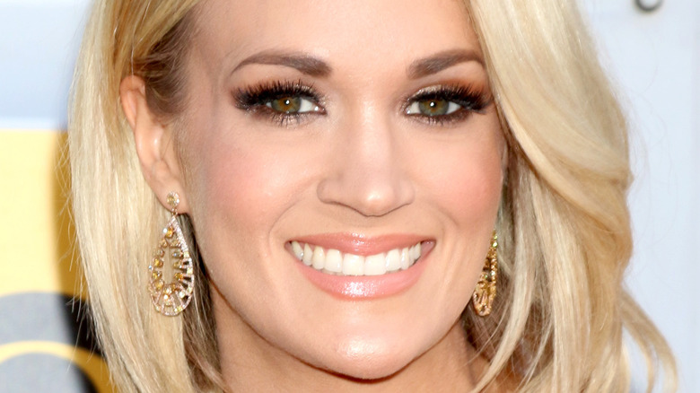 Smiling Carrie Underwood with shorter hair
