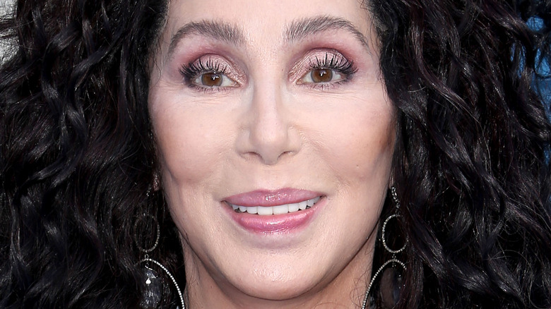 Cher smiles at an event
