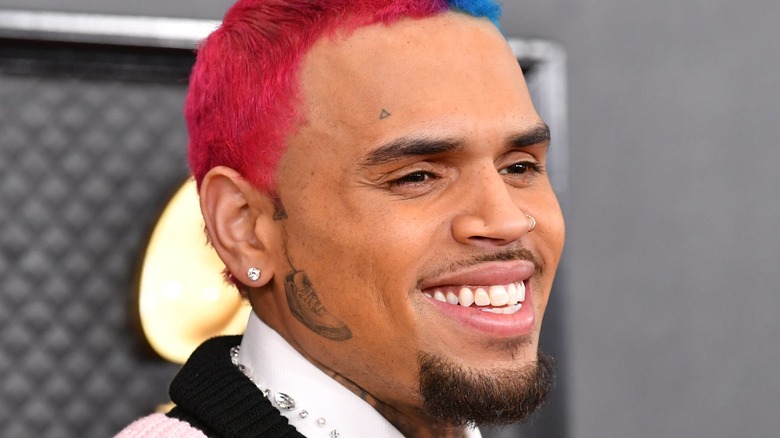 Chris Brown smiling on the red carpet