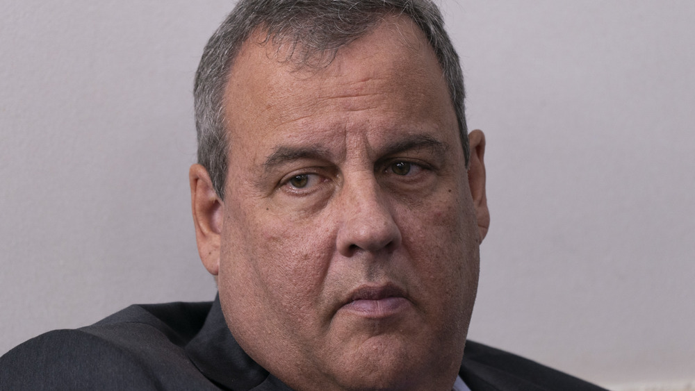 Chris Christie listening as Donald Trump speaks during a news conference